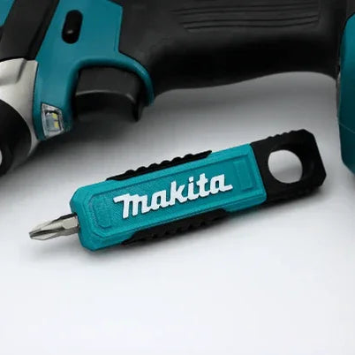Makita screwdriver and drill on a white background