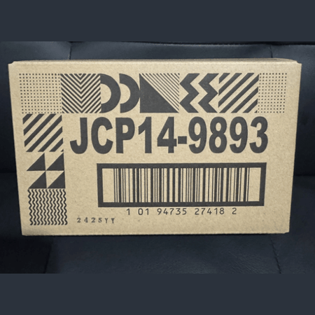 Cardboard box with geometric patterns and a barcode on a dark background