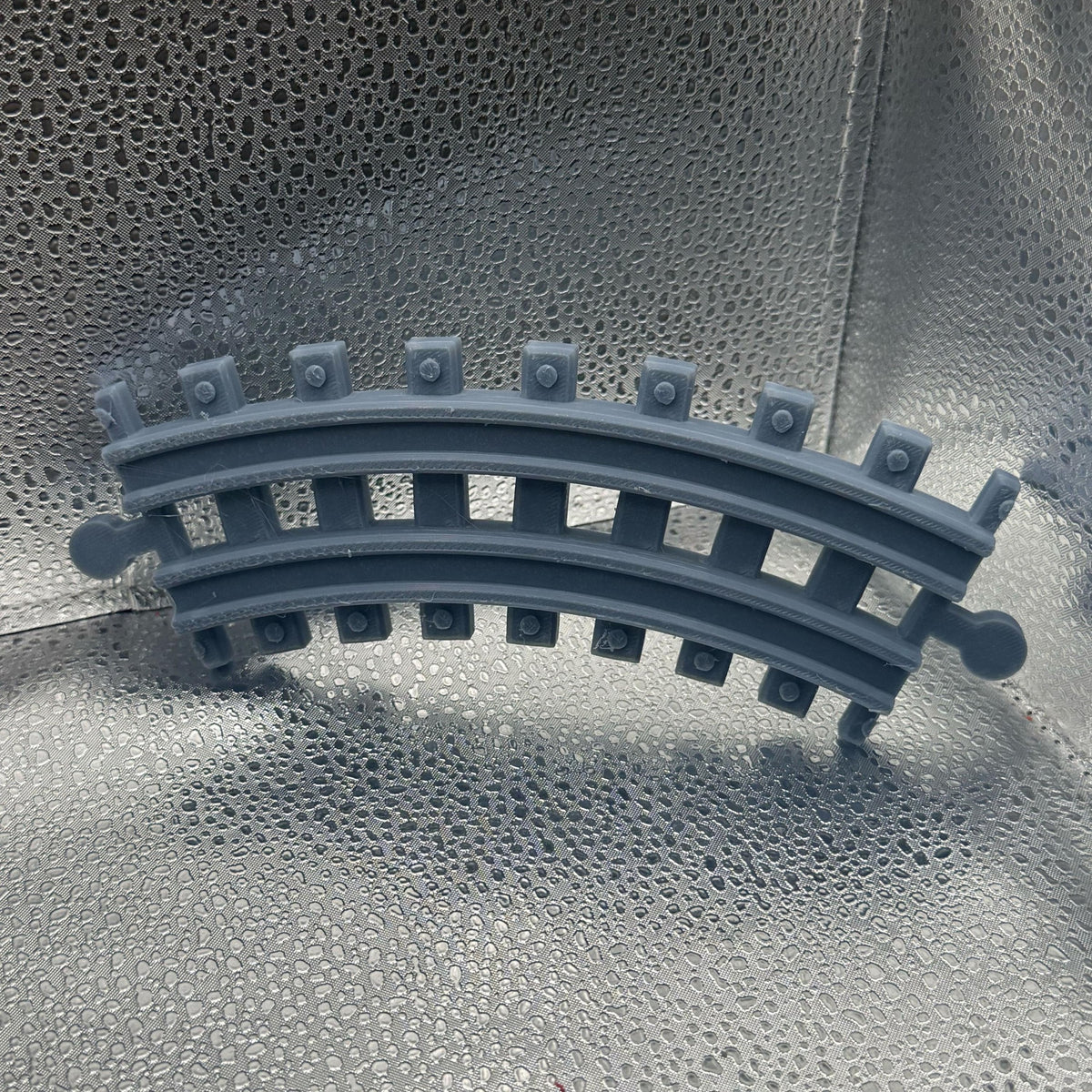 3D Printed Tiny Train Track Curve Male to Male 45 Degrees.
