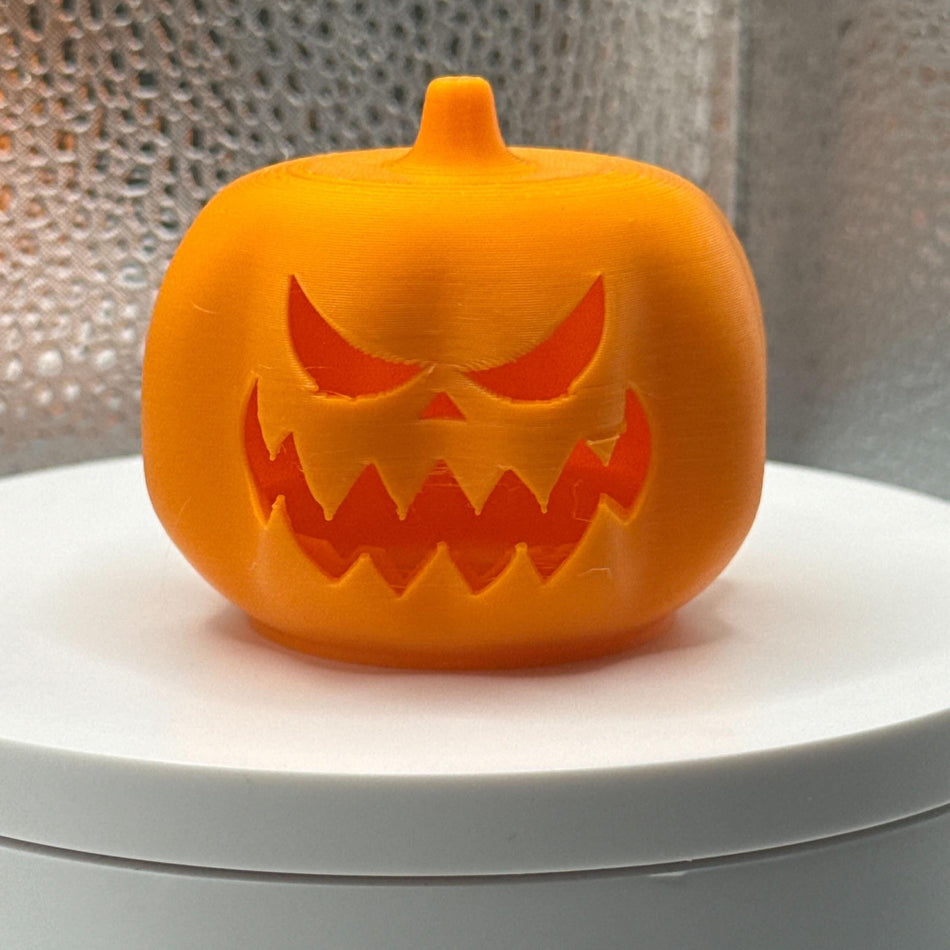 3D Printed Tealight Jack-O-Lantern.