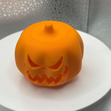 3D Printed Tealight Jack-O-Lantern.