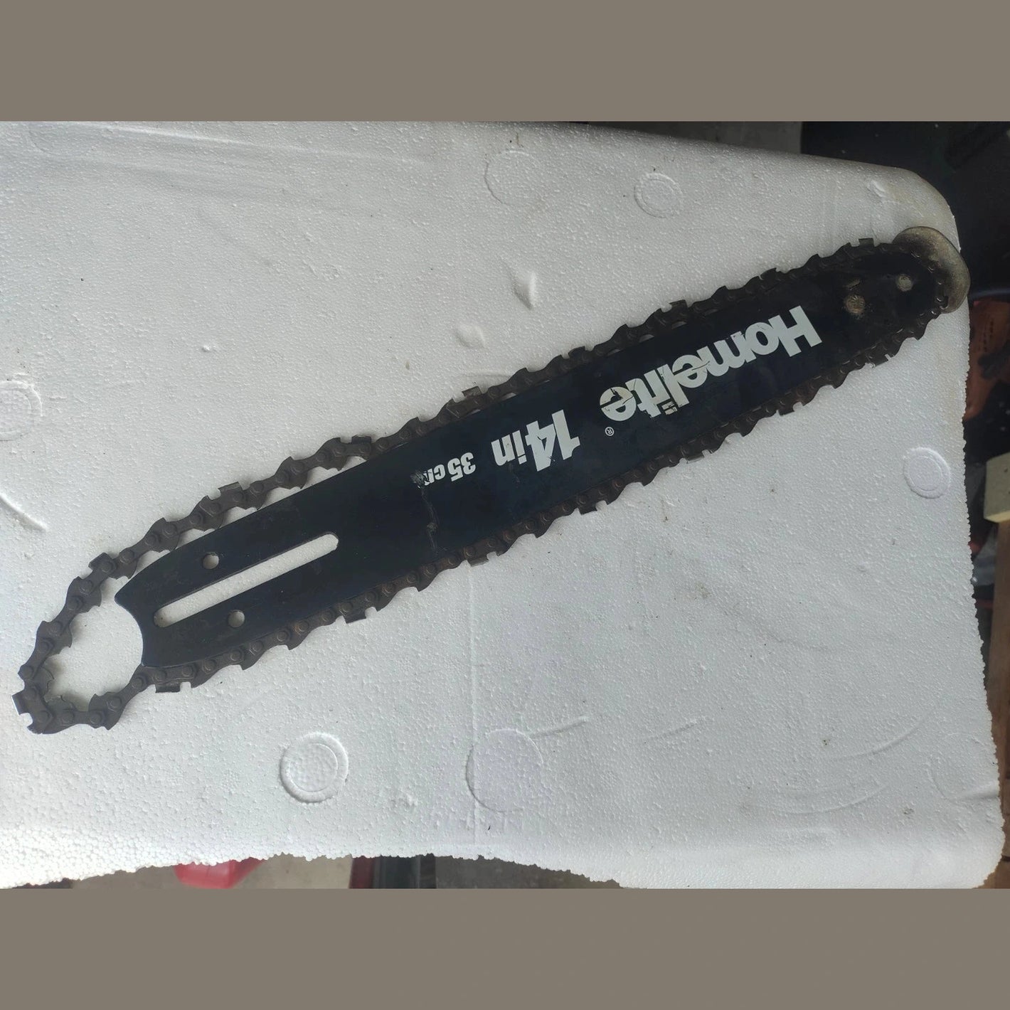 USED Homelite 14" 9amp ut43103a bar and chain electric chainsaw.