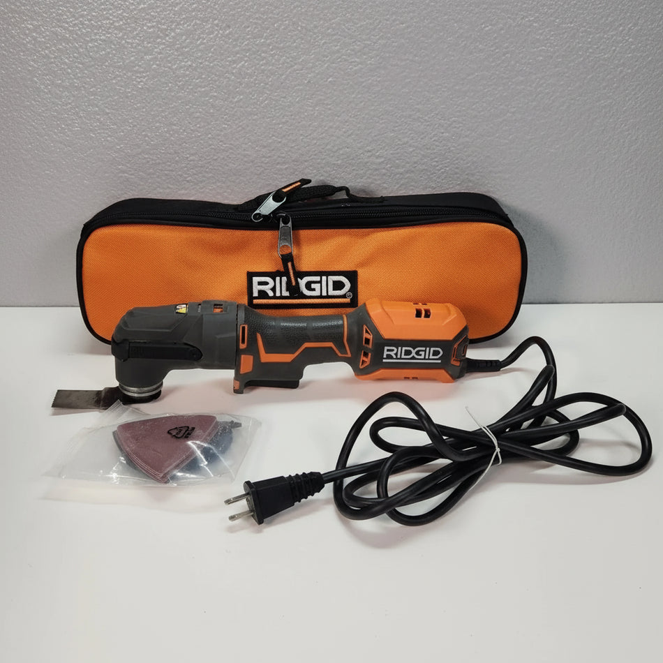 Ridgid oscillating tool set with case, cord, and accessories on a white surface.