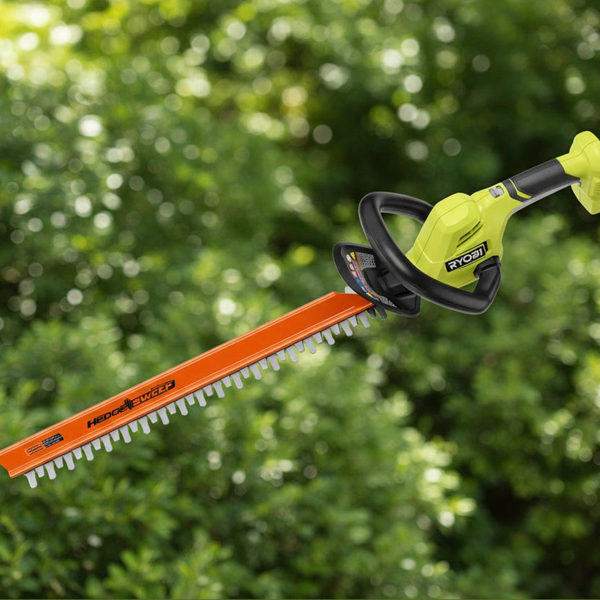 Electric hedge trimmer with orange blade and black handle on a white background