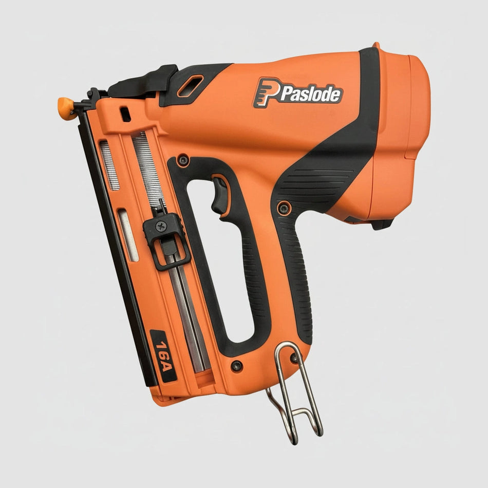 Orange Paslode nail gun on a wooden surface