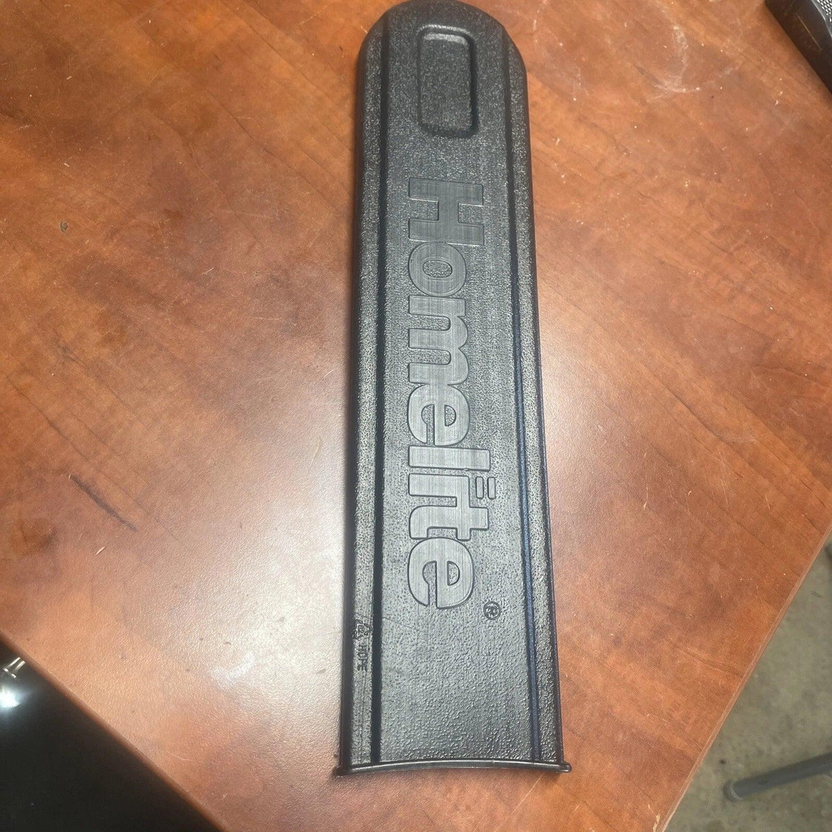 Black tool handle with 'Home Lite' branding on a wooden surface