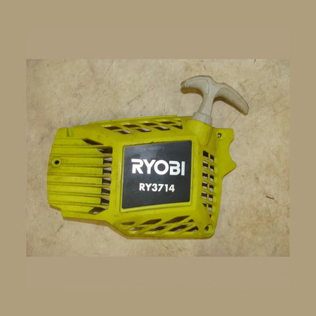 Yellow Ryobi battery pack on a wooden surface
