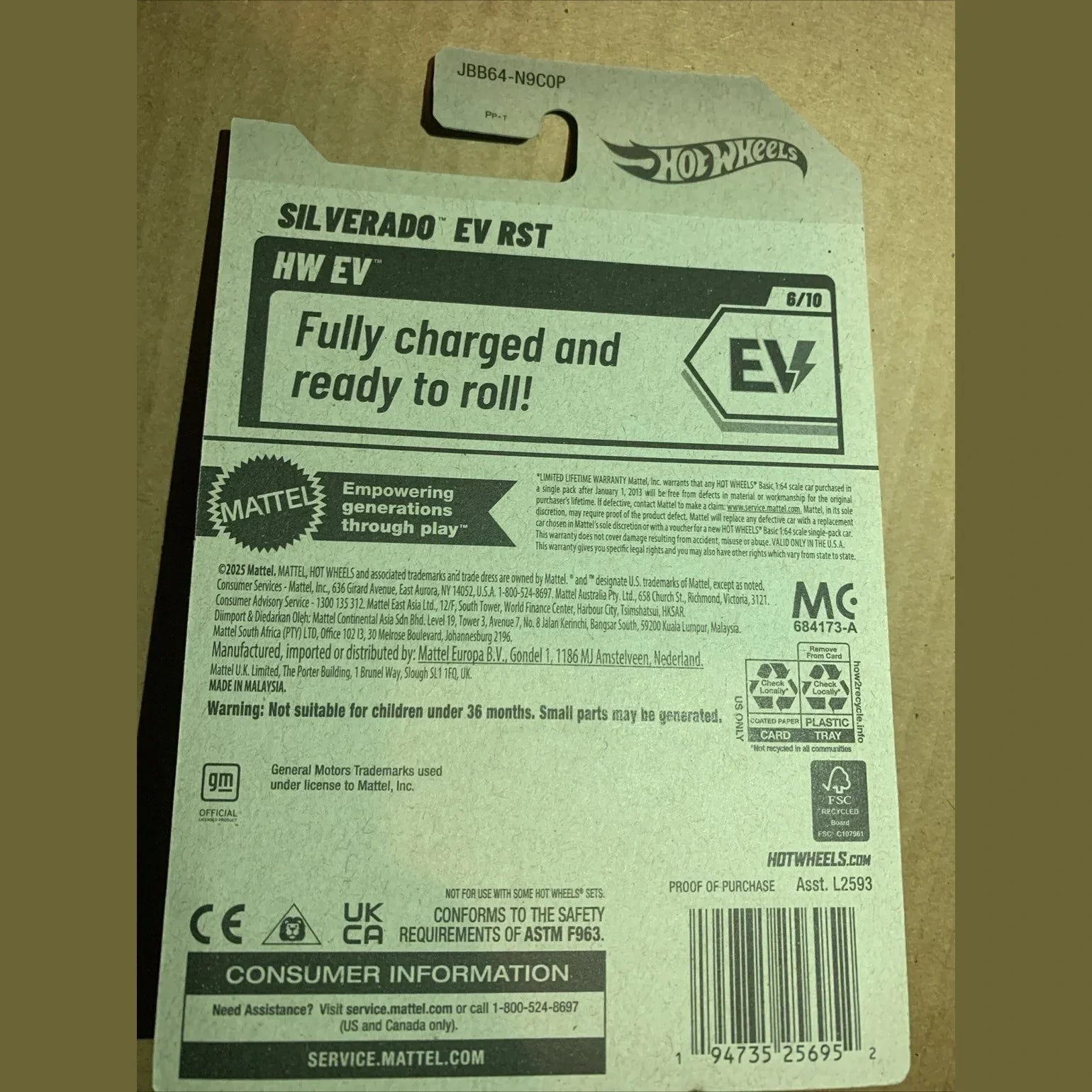 Hot Wheels Silverado EV RST toy packaging with branding and product details.