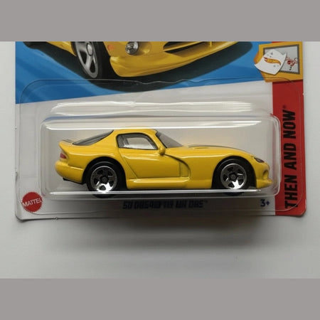 Yellow toy car in packaging with a visible Mattel logo.