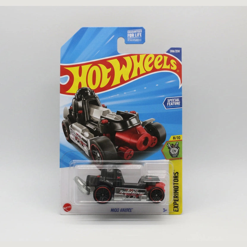 Hot Wheels toy car in packaging on a wooden surface