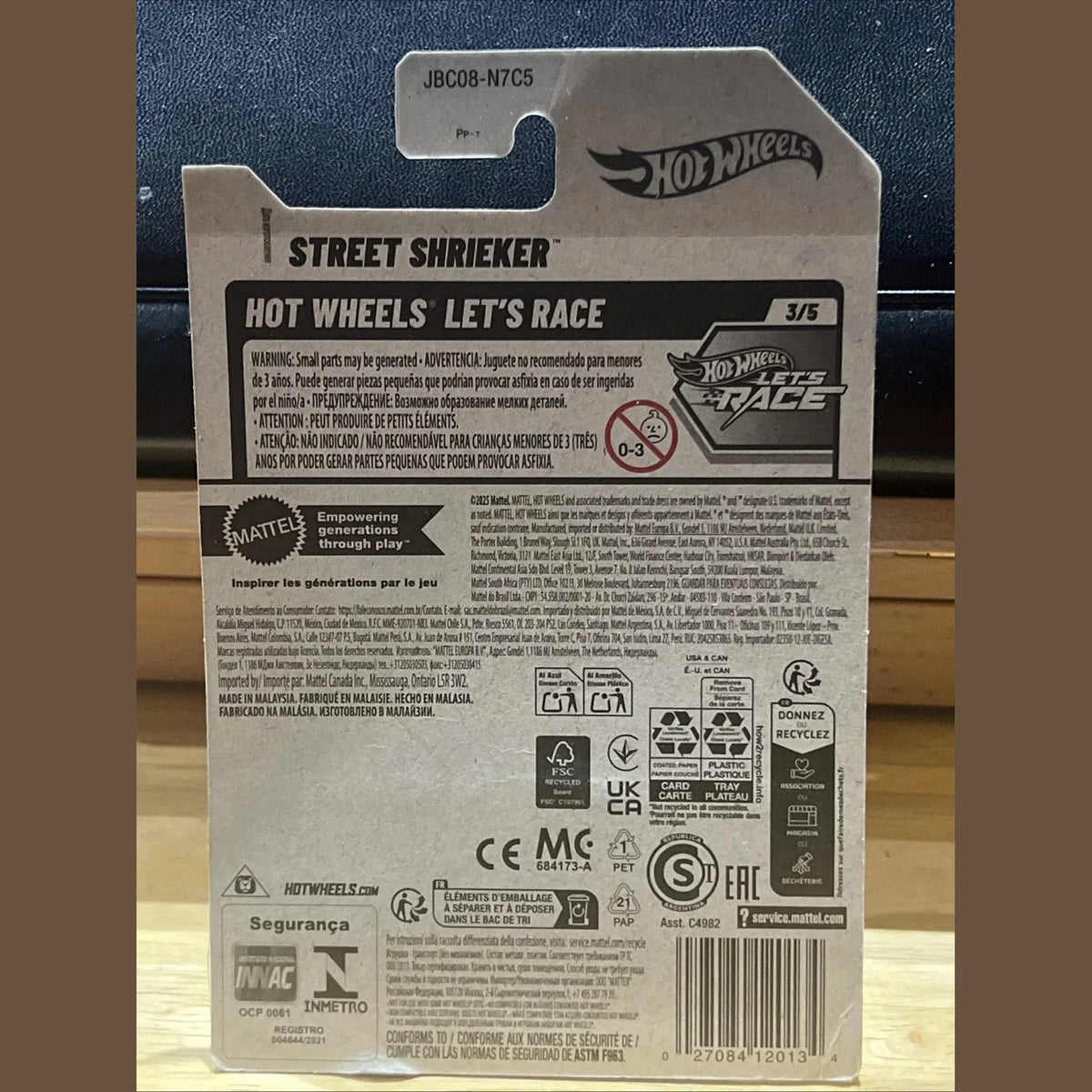 Back of a Hot Wheels packaging with branding and product details.