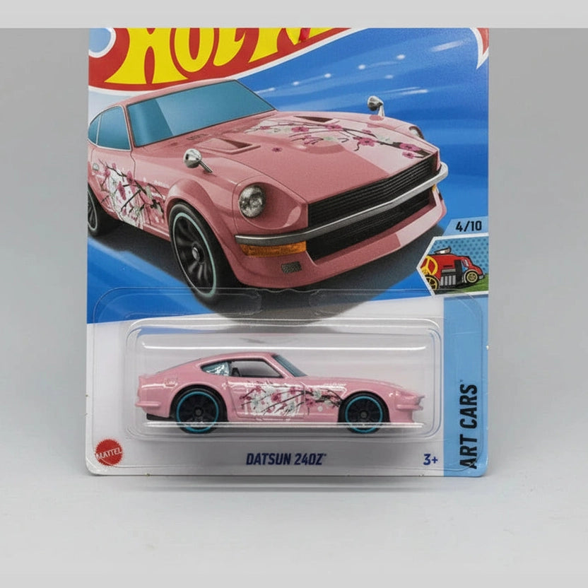 Pink Datsun 240Z toy car in Hot Wheels packaging on a gray background