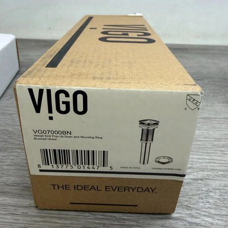 Cardboard box with VIGO branding on a gray surface