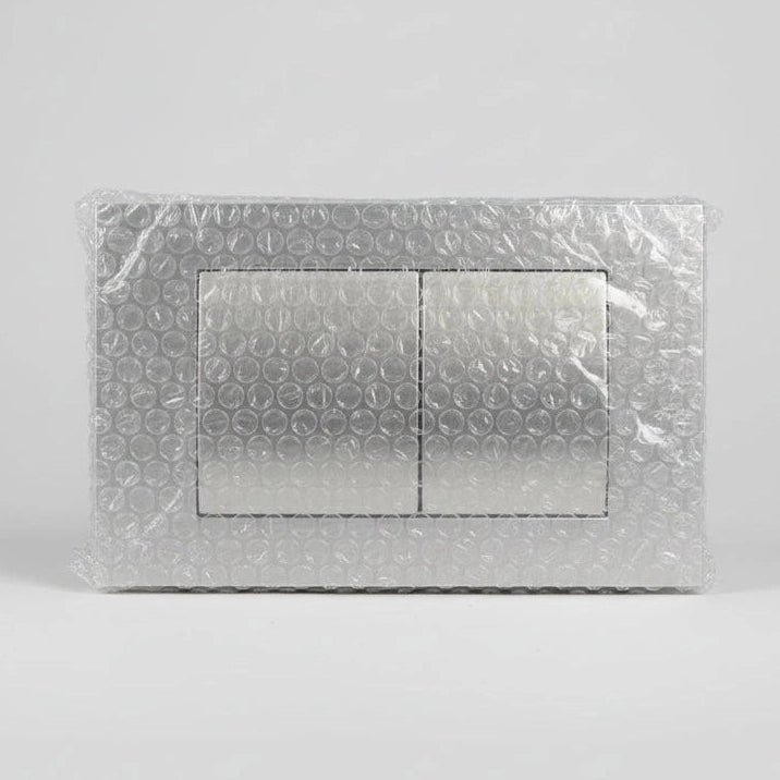 Metallic embossed card with decorative pattern on a wooden surface