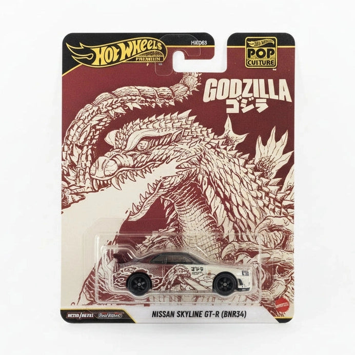 Hot Wheels Godzilla toy car in packaging on a gray background