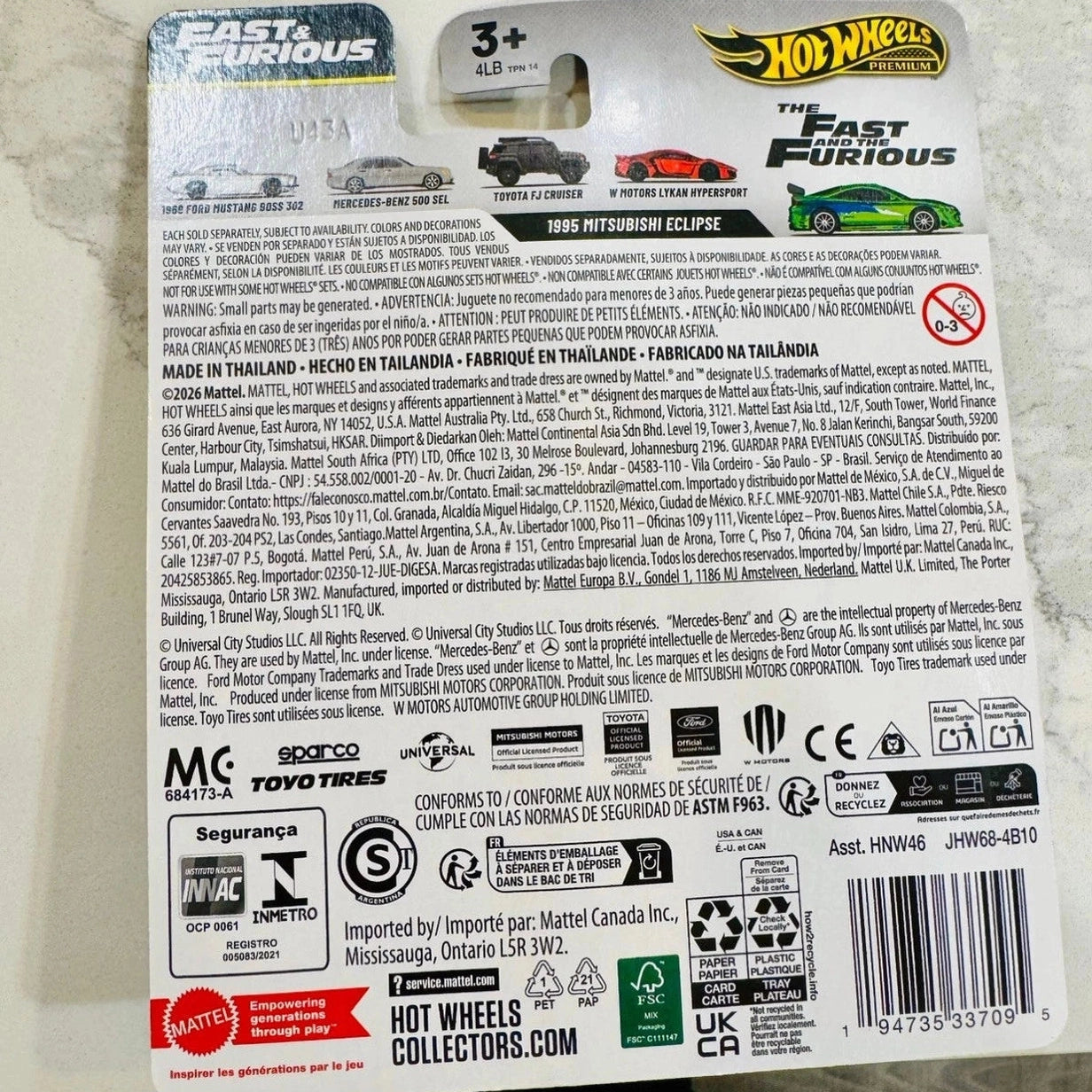 Hot Wheels toy car packaging with branding and product details on a neutral background