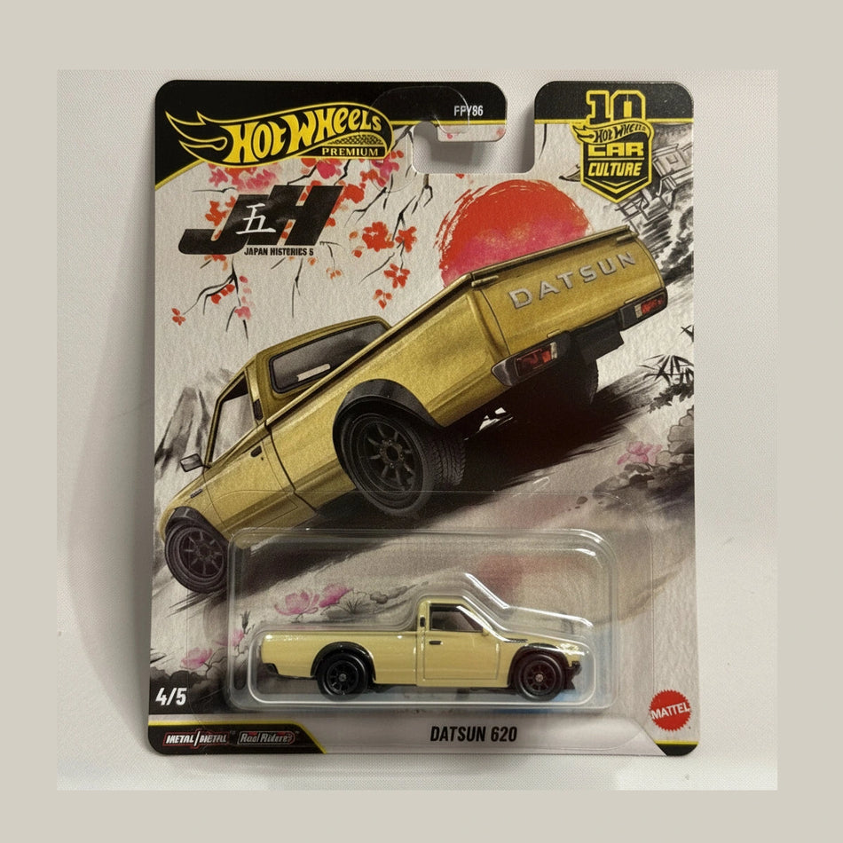 Hot Wheels Datsun 620 toy car in packaging with brand logos.