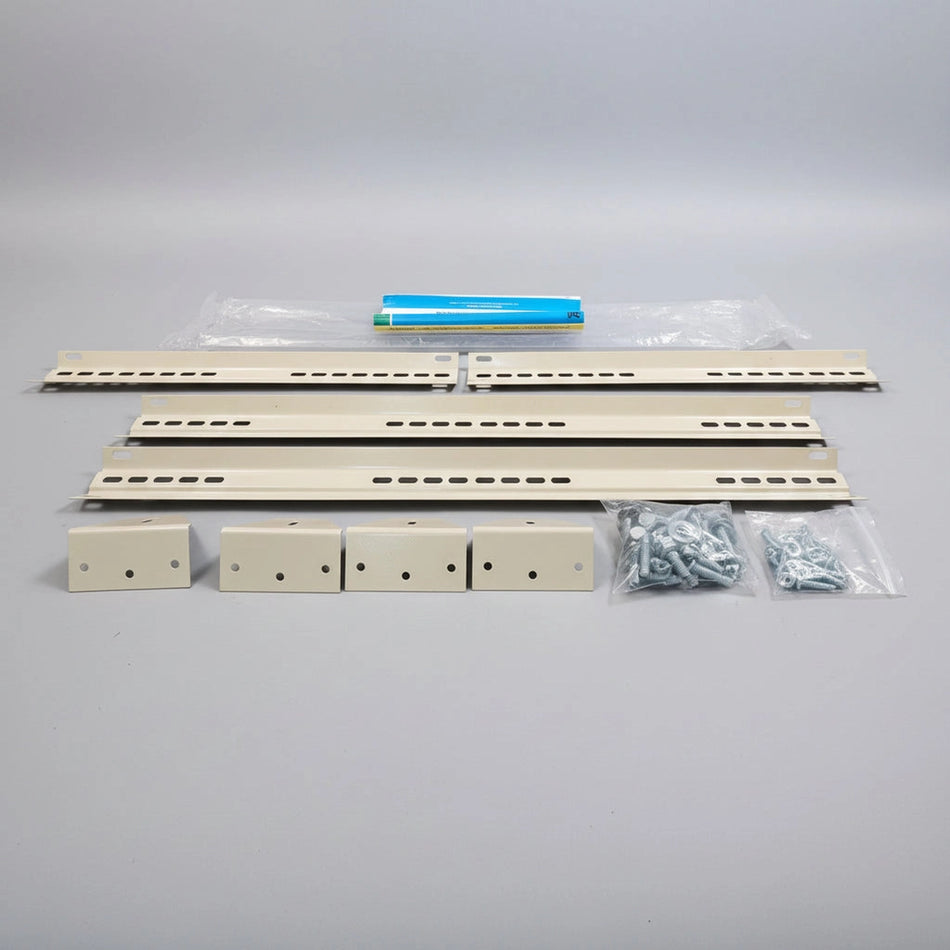 Set of metal brackets and components on a textured surface