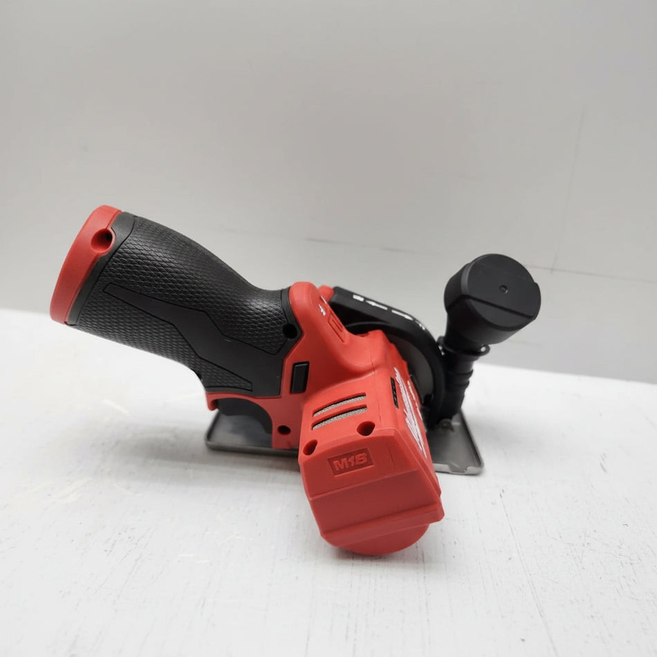 Red and black power tool on a white background
