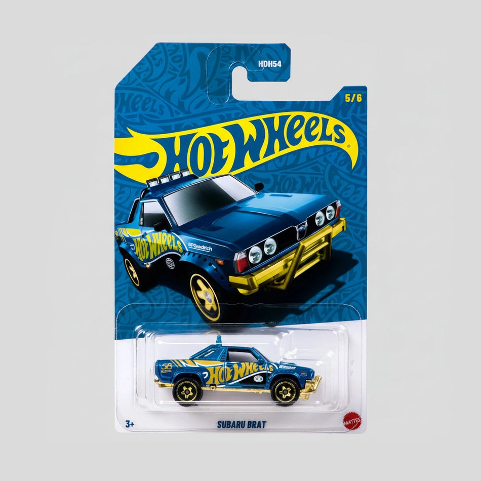 Hot Wheels Subaru Brat toy car in packaging with blue and yellow design