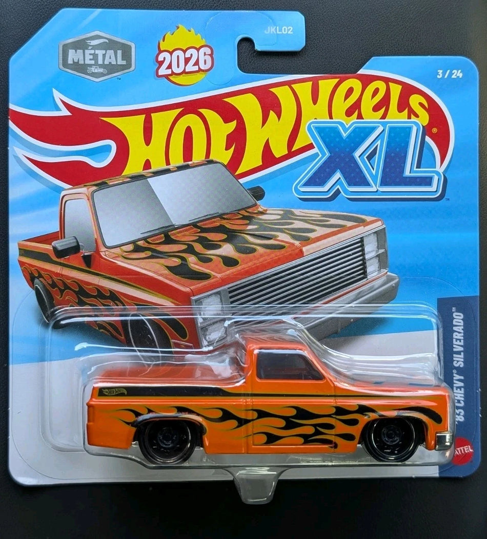 Hot Wheels XL toy truck in packaging with flame design on a blue background