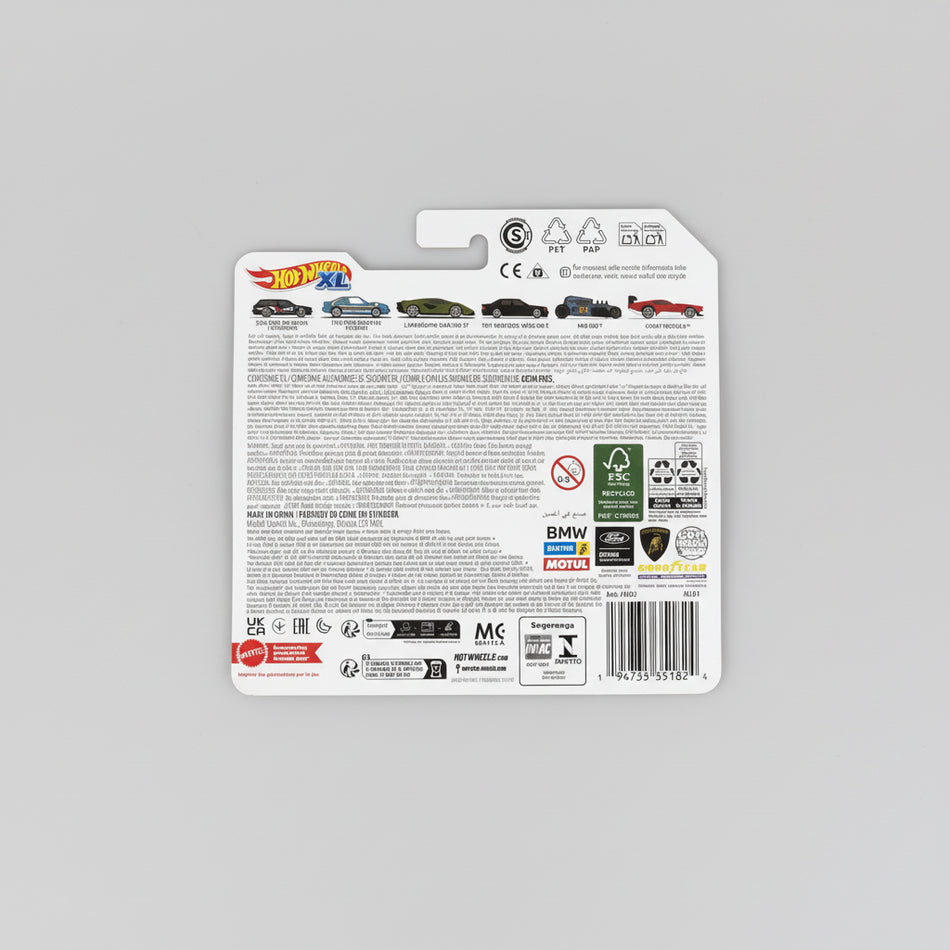 Hot Wheels packaging with branding and product details on a desk.