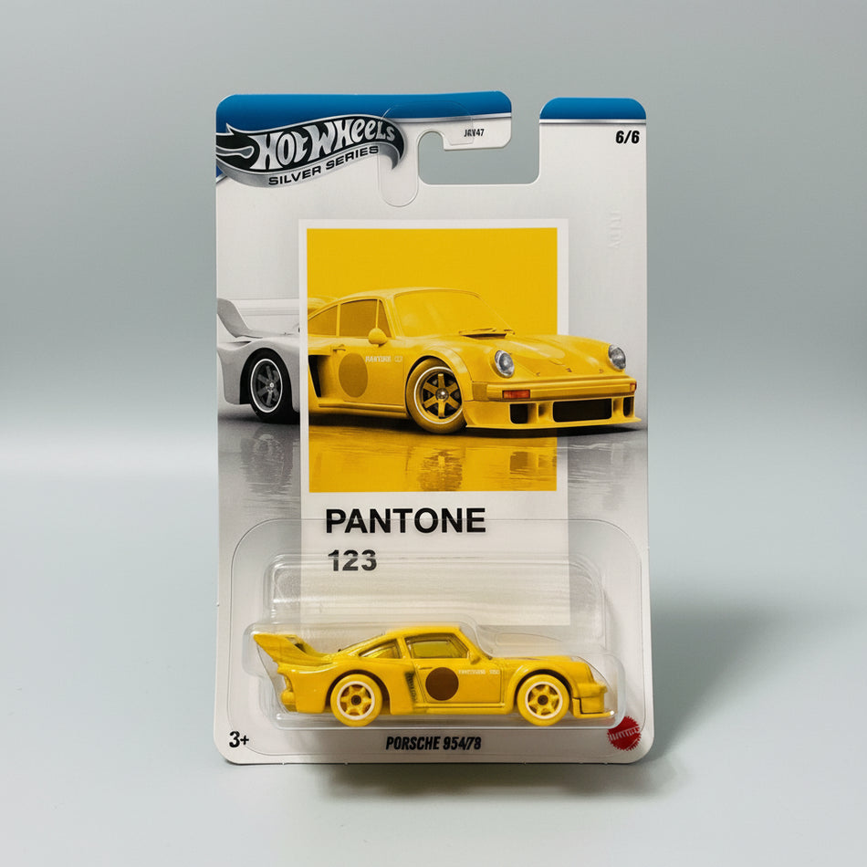 Hot Wheels car in Pantone 123 packaging on a wooden surface