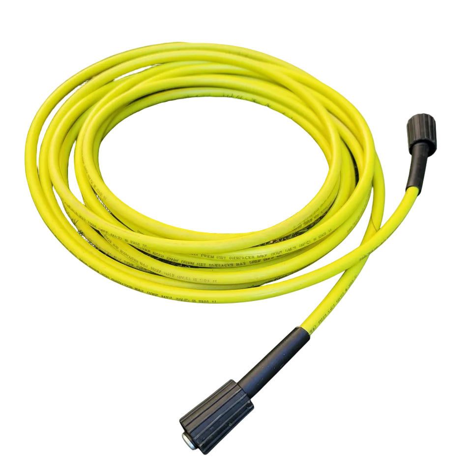 Coiled yellow garden hose on grass