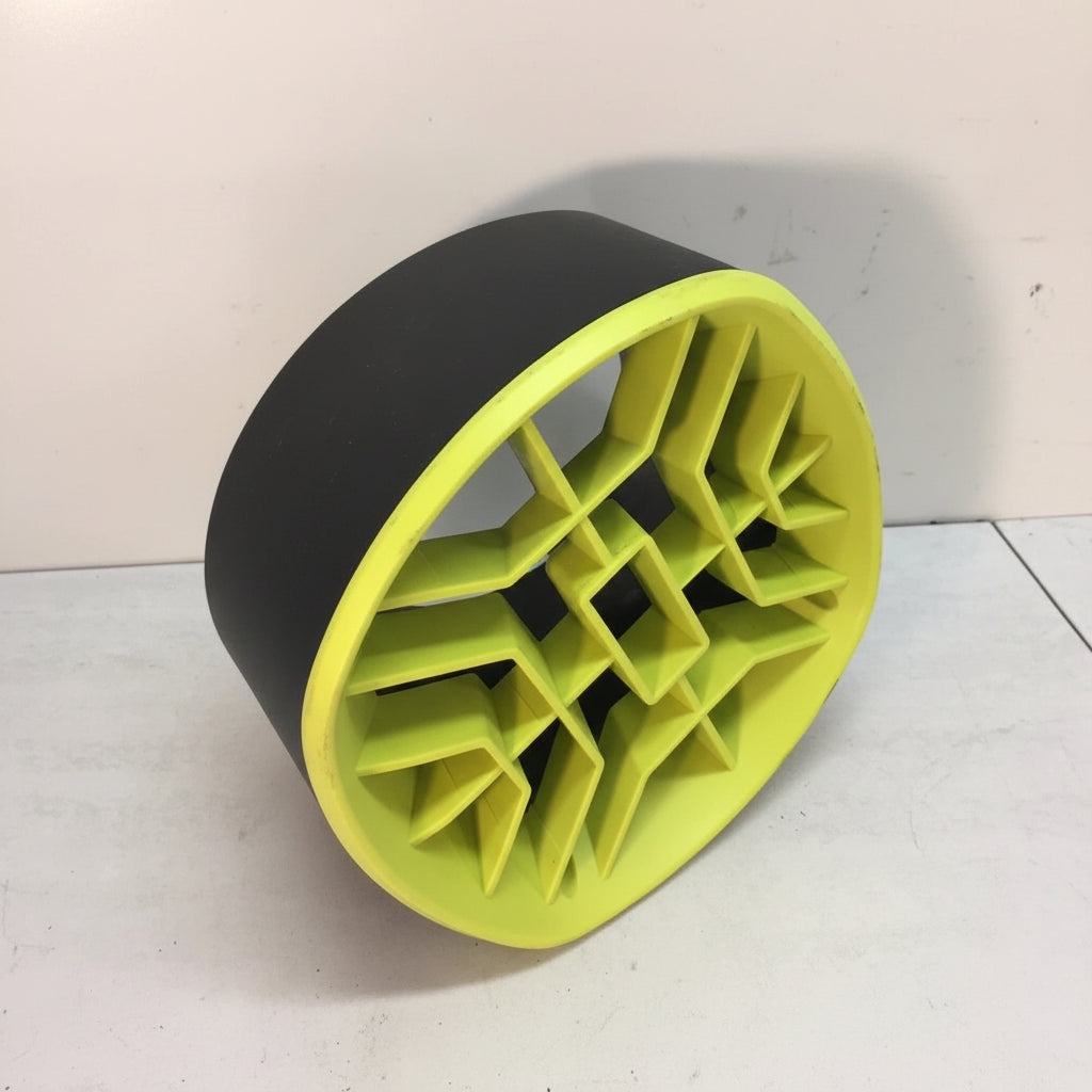 Yellow and black exercise roller on a white floor
