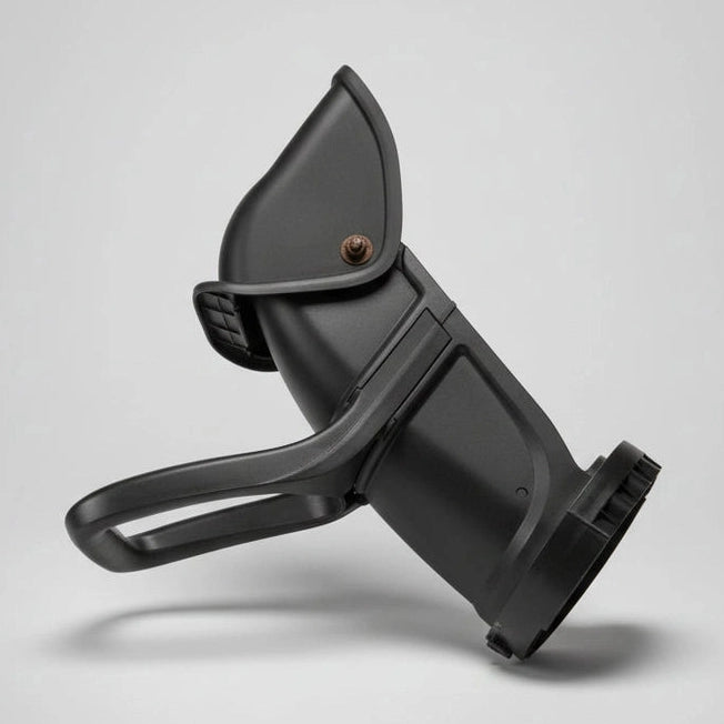 Black plastic tool on a wooden floor with a label