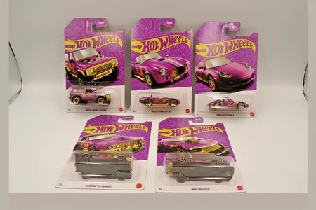 Hot Wheels cars in purple packaging on a gray background