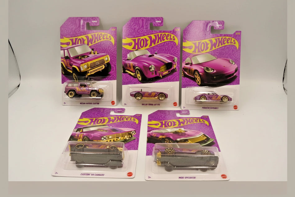 Hot Wheels cars in purple packaging on a gray background