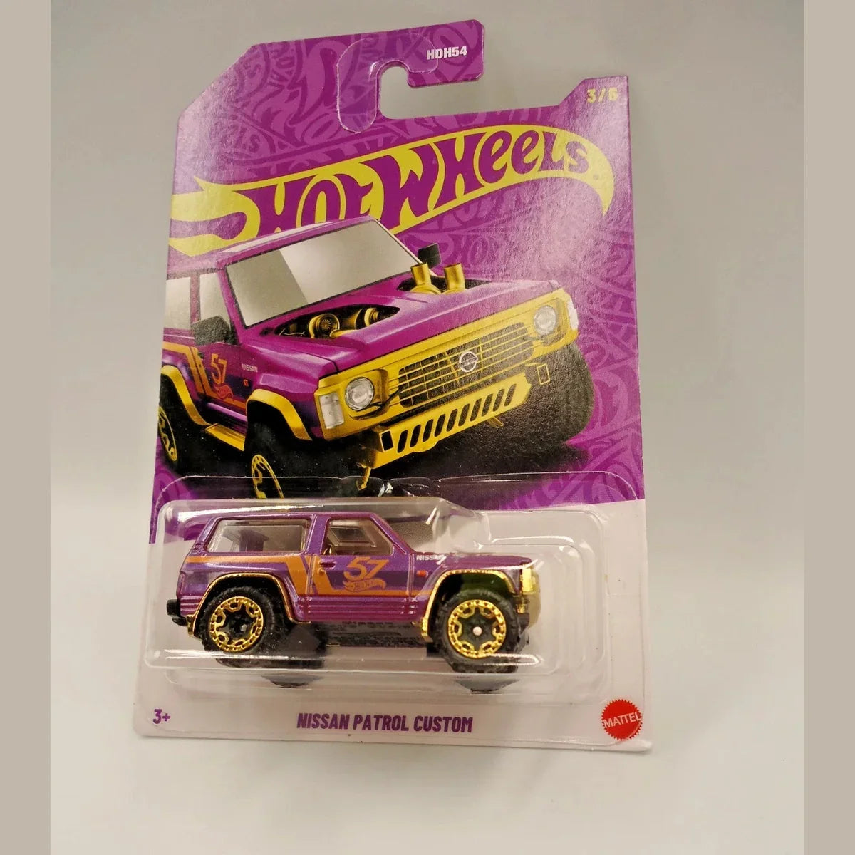 Hot Wheels Nissan Patrol Custom toy car in packaging on a gray background