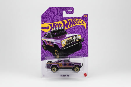 Hot Wheels '73 Jeep J10 toy car in purple packaging with Hot Wheels logo.